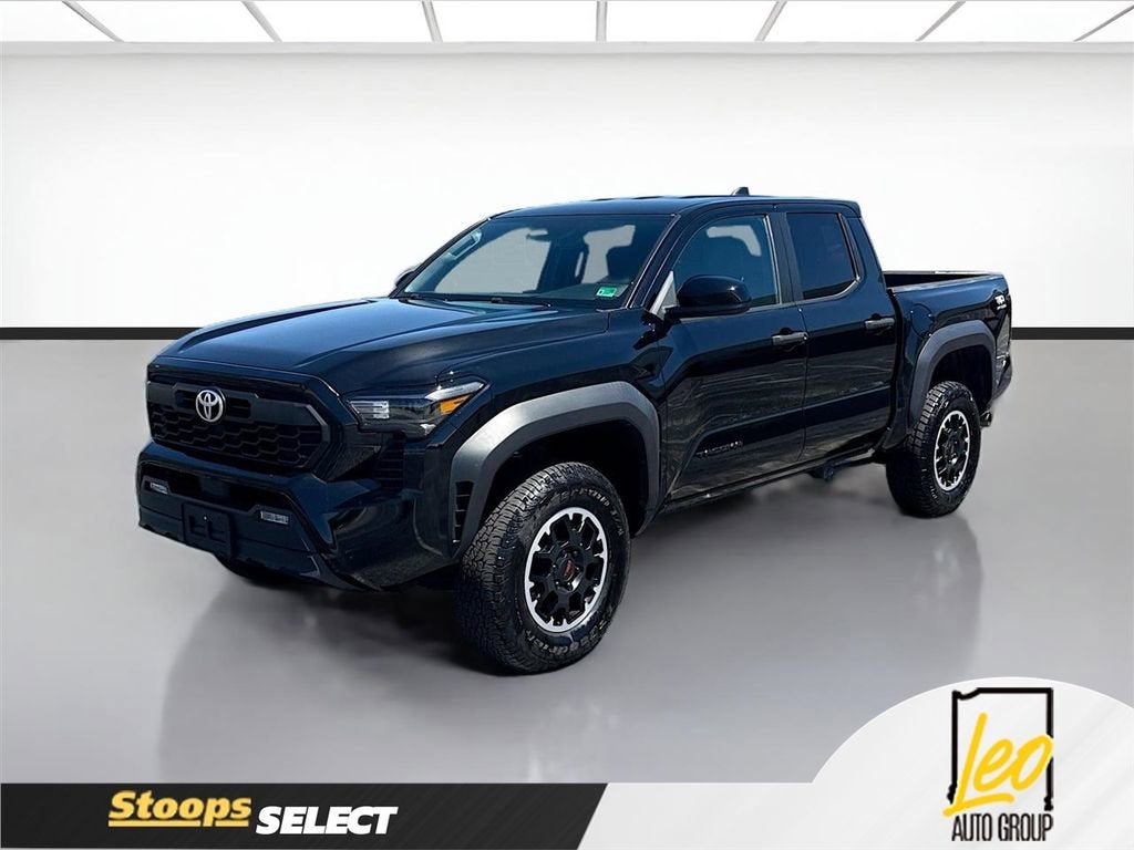 2024 Toyota Tacoma TRD Off Road in Black — front three-quarter view