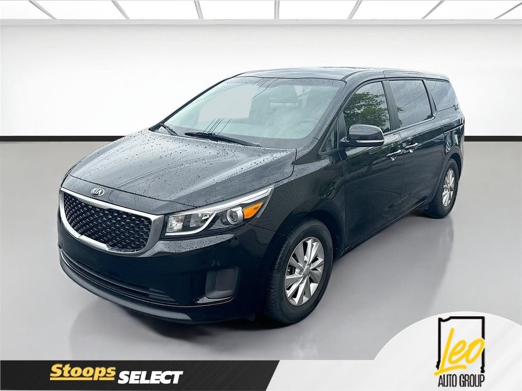2018 Kia Sedona L in Black — front three-quarter view