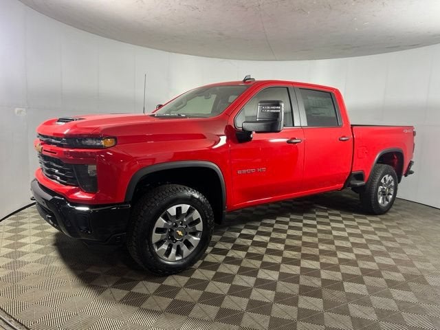 2026 Chevrolet Silverado 2500 HD Custom in Red Hot — front three-quarter view