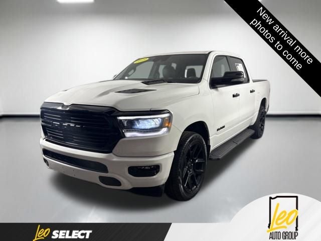 2023 RAM 1500 Laramie Crew Cab 4x4 5'7' Box in Bright White Clearcoat — front three-quarter view