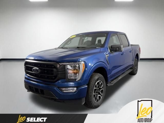 2023 Ford F-150 XLT in Blue Metallic — front three-quarter view