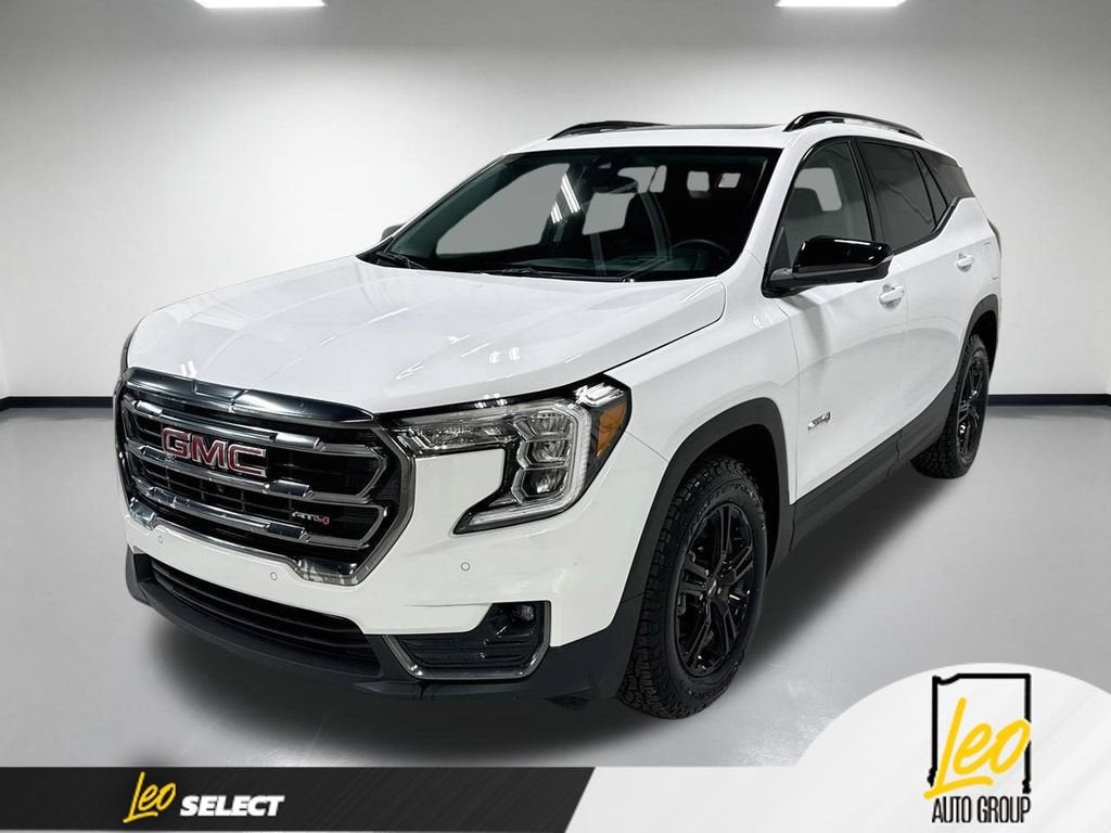 2024 GMC Terrain AT4 in Summit White — front three-quarter view